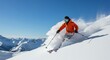 © Vagner - Man in orange jacket skiing down a snow covered mountain with blue sky and mountain range view