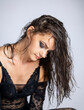 © Mauro Rodrigues - Young women posing with wet hair and black transparent bodysuit.