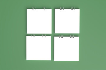 Poster - 4 Plain white binder books with green background neatly arranged in square shape. 3D blank mockup