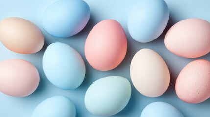 Poster - A row of colorful eggs are laid out in a pattern. The eggs are of different colors, including blue, pink, and yellow. The eggs are arranged in a way that creates a sense of harmony and balance