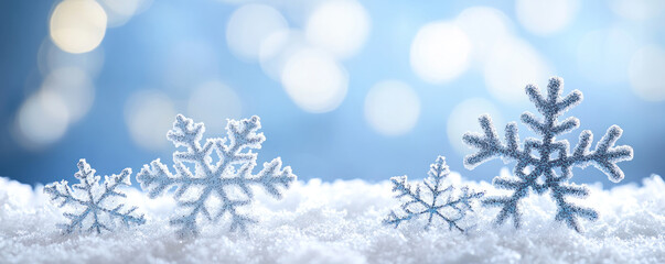 Poster - A snow-covered field with a few snowflakes scattered on the ground. The snowflakes are small and delicate, creating a serene and peaceful atmosphere