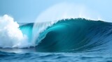 Powerful turquoise ocean wave crashing, perfect for themes of nature, power, and marine environments.
