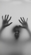 © AI Art - A blurry black-and-white photo of two hands behind foggy glass and a face screaming in terror is pressed on the foggy glass, creating an eerie atmosphere