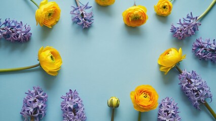 Wall Mural - a blue background with a yellow flower in the center surrounded by purple flowers. the flowers are a