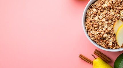 Poster - A close-up view showcases a pear and oat crumble on a white ceramic plate, beautifully garnished with cinnamon sticks and fresh pear slice on a soft pink background