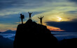 © emerald_media - Successful mountaineering team reaches the summit of misty mountains