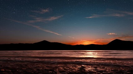 Wall Mural - a a movement of stars in the night sky with the view of mountains.