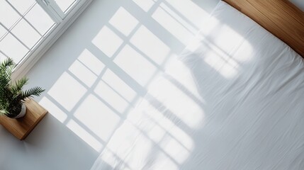 Poster - A tranquil bedroom features a natural wood bedframe, crisp white linens, and a potted plant on a sleek nightstand, providing a serene atmosphere and ample copy space