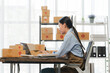© Kritdanai - Asian Woman Managing Small Business Online