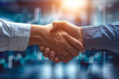 © resalovespixel - Close up of charming handshake with charming blurred financial growth chart in background, depicting interconnectedness of personal connections and economic progress