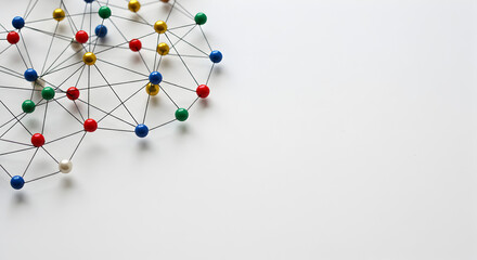 Poster - Connected Multicolored Push Pins Network on a Clean White Backdrop Represents Interconnectedness