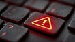 © JGenerative - Alert Symbol on Computer Keyboard with Red Backlight for Warning