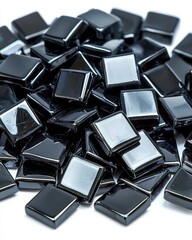 Poster - A captivating pile of shimmering black glass pieces displaying unique shapes and textures together