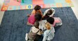 © peopleimages.com - Above, education and drawing with kids in classroom for child development, artwork and creative project. Youth, academy and growth with students at school for knowledge, learning and kindergarten
