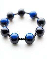 Poster - Elegant black and blue beaded bracelet showcasing intricate design and unique color combination
