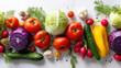 © mamah - Colorful assortment of fresh vegetables arranged in a horizontal line against a white background.