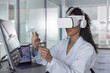 © ReeldealHD images - Focused woman Scientist Working with Virtual Reality Tools