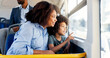© peopleimages.com - Talking, bus or travel with mom, kid or smile for commute on urban journey, holiday or trip. Mother, window or boy child with parent in city for sightseeing, public transport or morning adventure