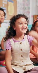 Poster - Happy, student and child with answer in classroom, growth and development with knowledge and learning. Elementary, group and girl with smile for education, back to school and hand up for question