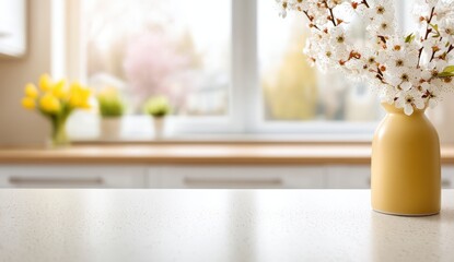 Poster - A yellow vase with white blossoms sits on a bright kitchen counter, with flowers and plants blurred by a sunny window in the background.