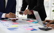© Wasan - Businessman meeting with financial advisors analyzing market share and sales situation to solve problems and plan business strategies.