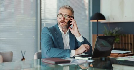 Poster - Office, businessman and phone call with laptop for talking, accountant and audit report. Career, mature person and auditor with mobile for communication, financial research and investment review