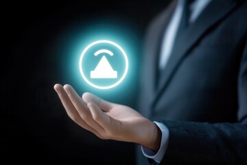 Poster - Business professional presenting a glowing warning symbol in a dark environment