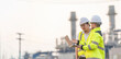 © reewungjunerr - Group Asian man petrochemical engineer working at oil and gas refinery plant industry factory,The people worker man engineer work control at power plant energy industry manufacturing