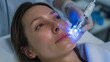 © ALSADRA - Young woman receiving comfortable LED light facial therapy at beauty clinic, perfect for skincare advertising, wellness campaigns, dermatology visuals, and beauty promotions