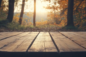 Poster - Rustic Wooden Tabletop Displaying Autumnal Forest Backdrop with Warm Sunlight and Golden Leaves Creating a Tranquil Outdoor Scene for Product Mockups
