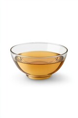 Poster - Golden liquid in clear glass bowl on white background creating a minimalist and clean aesthetic perfect for organic food and drink concepts in a modern style