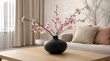 © Rasel - Minimalist black vase with cherry blossoms