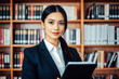 © Evgenii Starkov - Professional Woman in Library with Documents