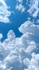 Wall Mural - sunny sky, fluffy cumulus clouds, vibrant blue, background for design