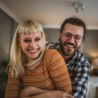 © Miljan Živković - Portrait of adult couple hug and smile at home happy together