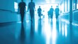© ganteng - blurred figures walking down the long hallway in the hospital ba