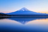 Majestic mount fuji reflecting on the serene surface of a tranquil lake