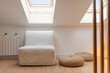 © Milles Team/Stocksy - Armchair and poufs at home