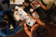 © Milles Team/Stocksy - Businesspeople exchanging documents at meeting room