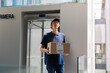 © Milles Team/Stocksy - Deliveryman delivering parcel to client