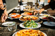 © CWP, LLC/Stocksy - Family Style Italian Dinner