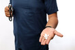 © ArvStd - Male doctor offering pills capsules white to the patient in hand isolated on a white background. Focus on tablets