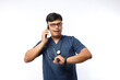 © ArvStd - Male doctor with stethoscope talking on mobile phone on white background