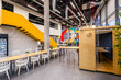 © VICTOR TORRES/Stocksy - Modern collaborative workspace with vibrant interior design