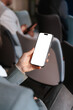 © DZ FILM/Stocksy - A woman uses a mobile phone with white screen