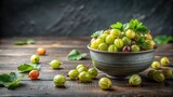 Fresh gooseberry in gray bowl on a table