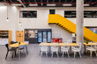 © VICTOR TORRES/Stocksy - Modern office cafeteria with vibrant design