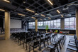 © VICTOR TORRES/Stocksy - Modern conference room with rows of black chairs