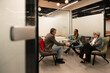 © VICTOR TORRES/Stocksy - Business discussion in modern office meeting room