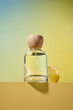© Marc Tran/Stocksy - Elegant perfume bottle with a natural wooden cap and a lemon slice